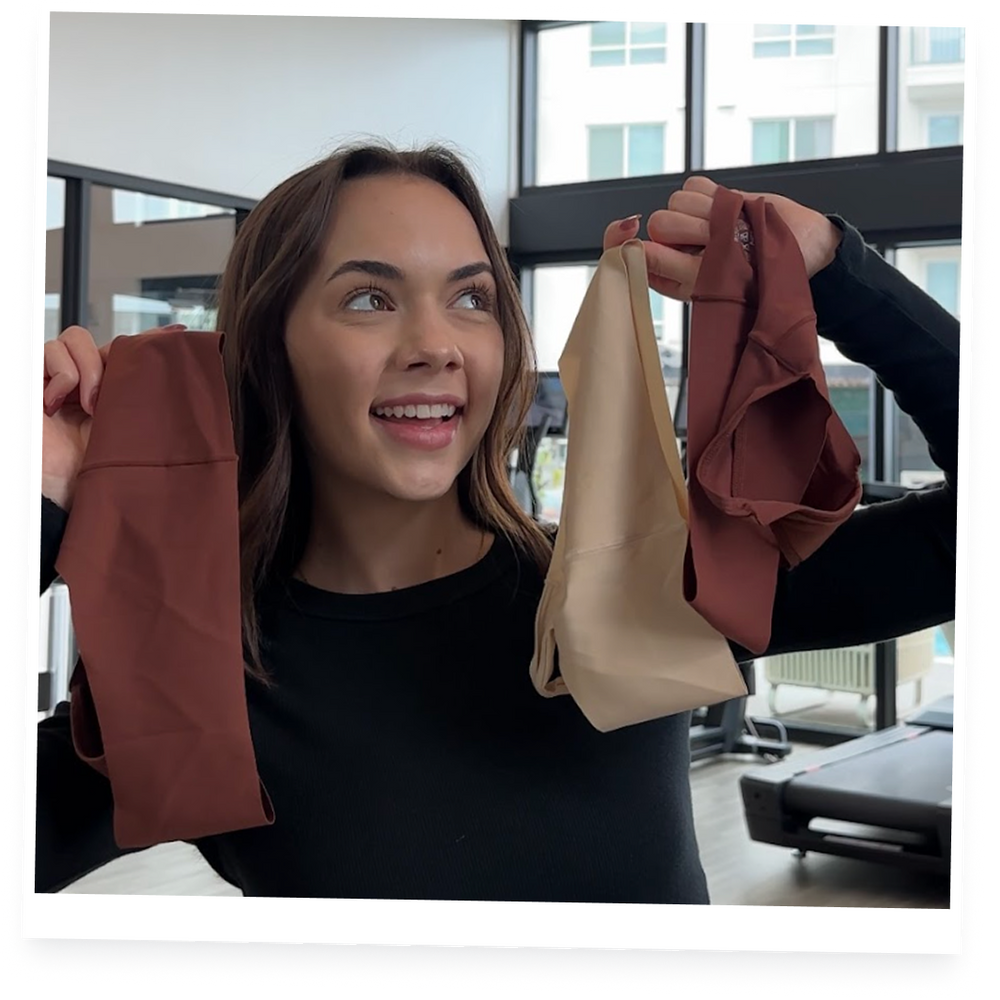 Woman holding different underwear colours